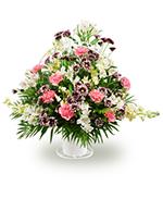 Mixed flowers in a handheld basket